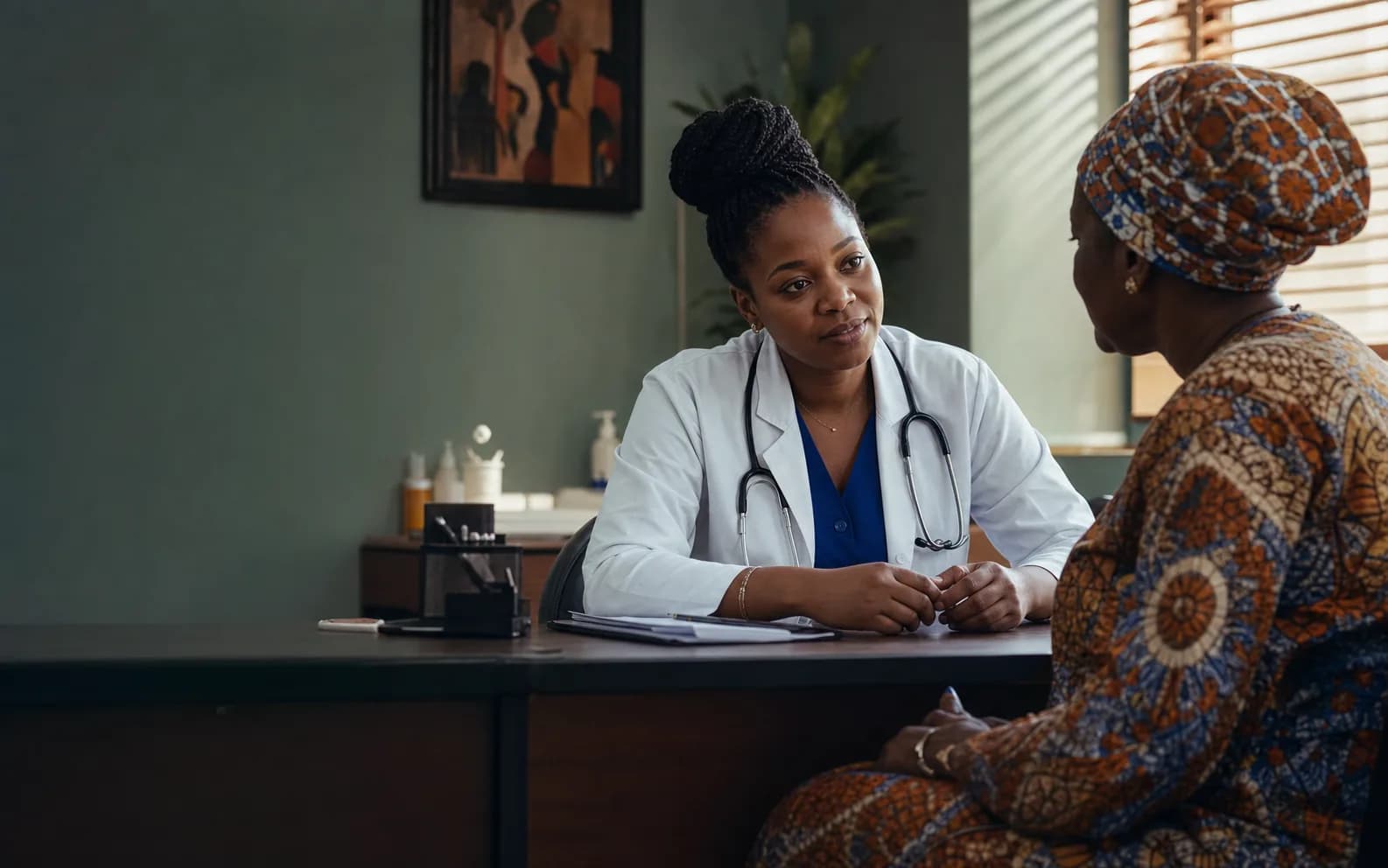 A doctor listening during a consultation